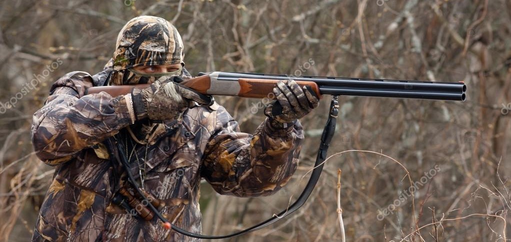 depositphotos 58402043 stock photo hunter takes aim from a