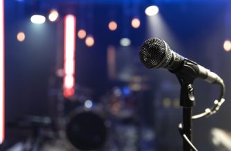 close up of a microphone on a concert stage with beautiful lighting 169016 11074
