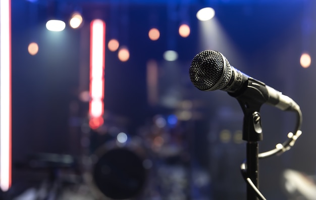 close up of a microphone on a concert stage with beautiful lighting 169016 11074