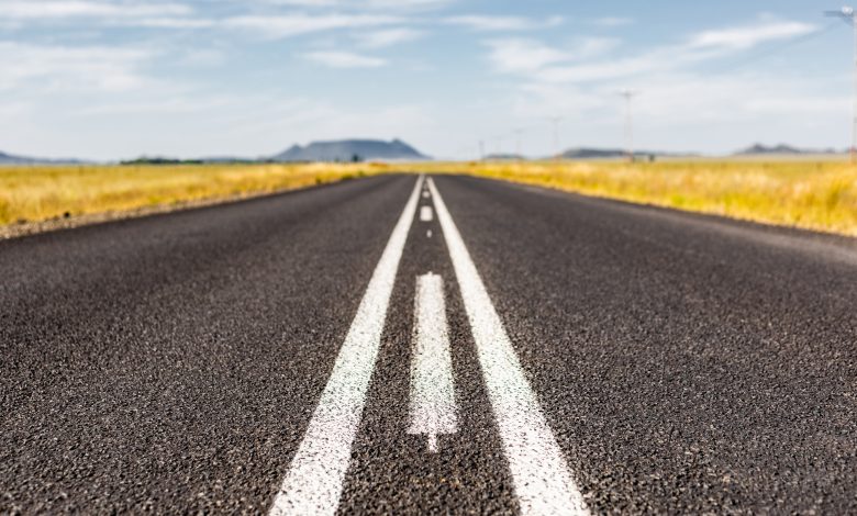 asphalt road across countryside